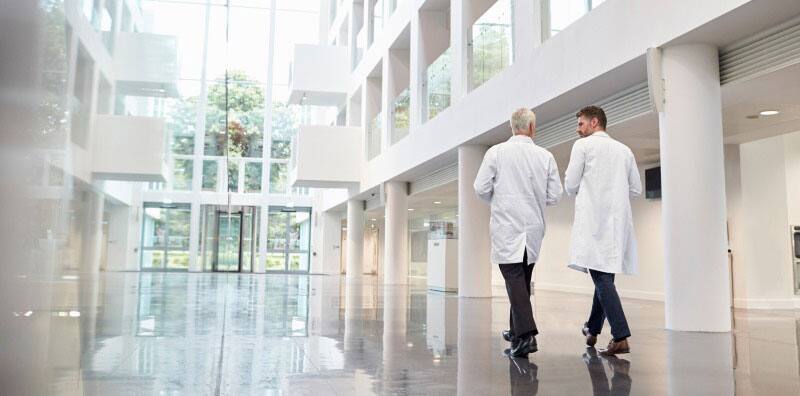 doctors walking in hospital corridor