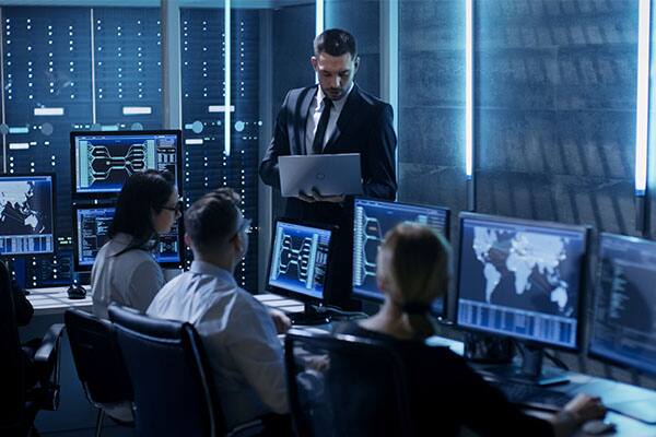 people working in front of monitors