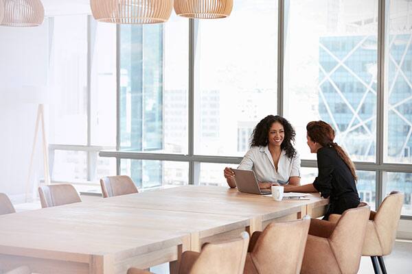 Two women sitting and discussing
