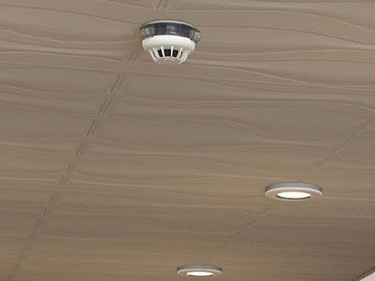 white dome shaped smoke detector