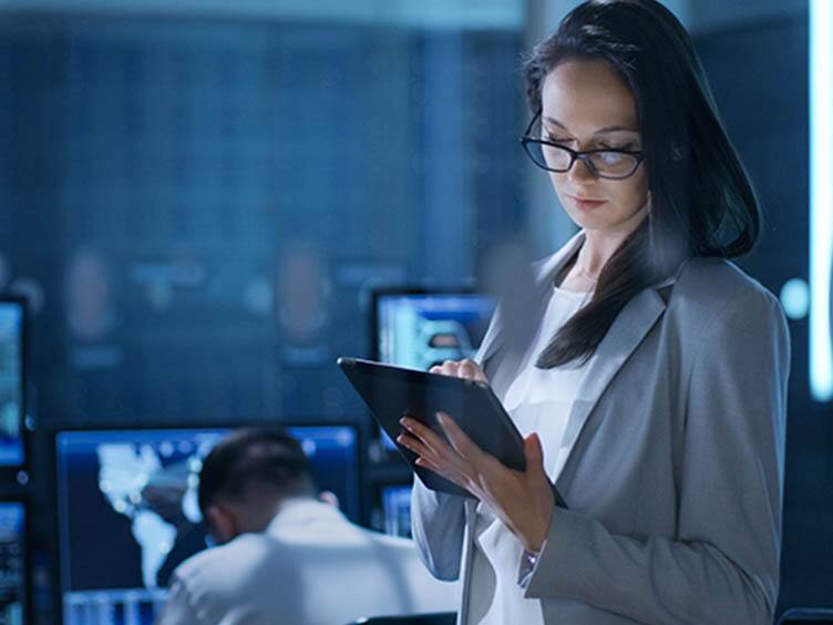 A woman using a tab at office