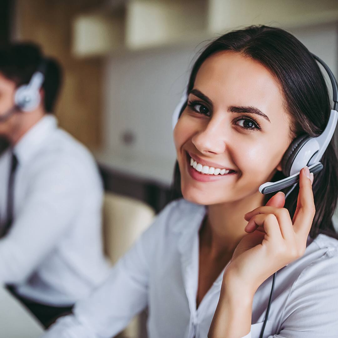 Call center representative using headset for customer support and service assistance