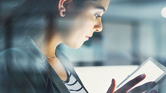 woman using tablet side profile