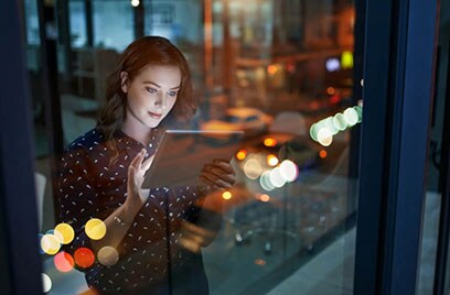 woman scrolling on a tablet