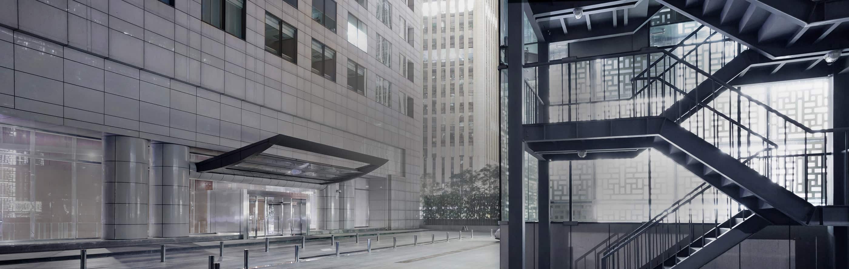 A stairwell along the parking lot of a building