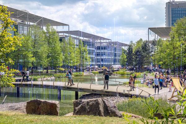 Landscape of healthy buildings campus with people and rising power nodes